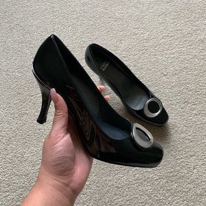 women’s Stuart Weitzman black patent pumps